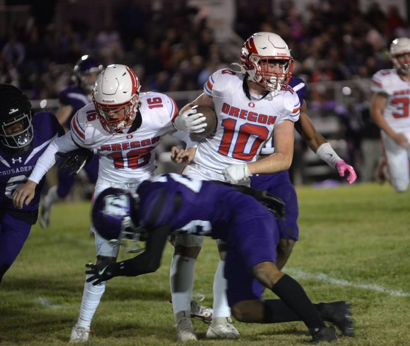 Oregon's Keaton Salsbury (10) runs for a gain as Leyton Kenney (16) blocks during Friday, Oct. 18, 2024 action against Rockford Lutheran in Rockford.