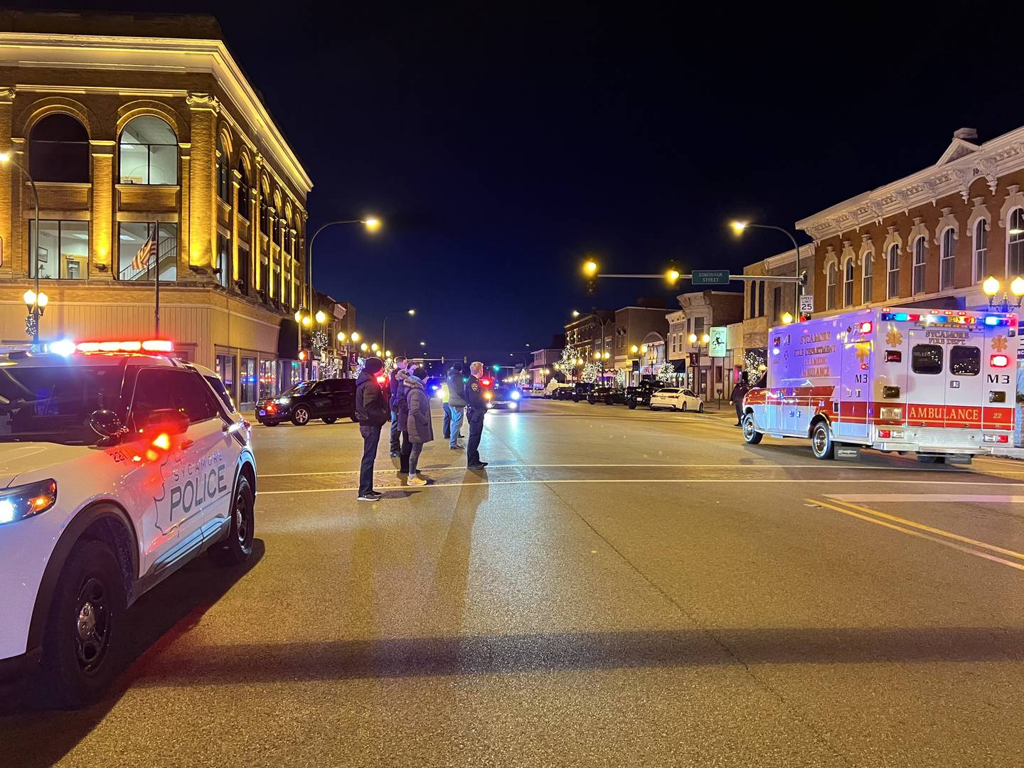 A crowd gathered to stand on State Street to welcome Sycamore firefighter Brad Belanger home from Northwestern Medicine Central DuPage Hospital on Monday, Dec. 18, 2023.