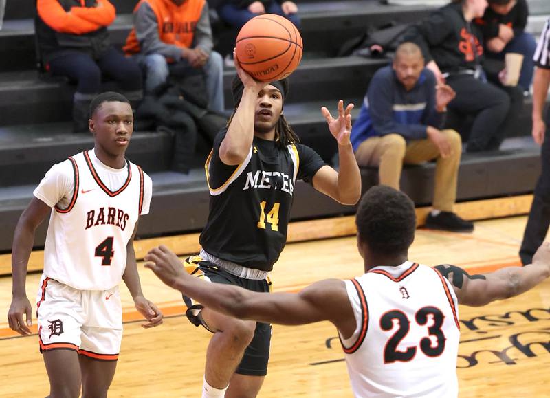 Metea Valley's James Parker shoots over DeKalb’s Davon Grant during their game Friday, Jan. 19, 2024, at DeKalb High School.