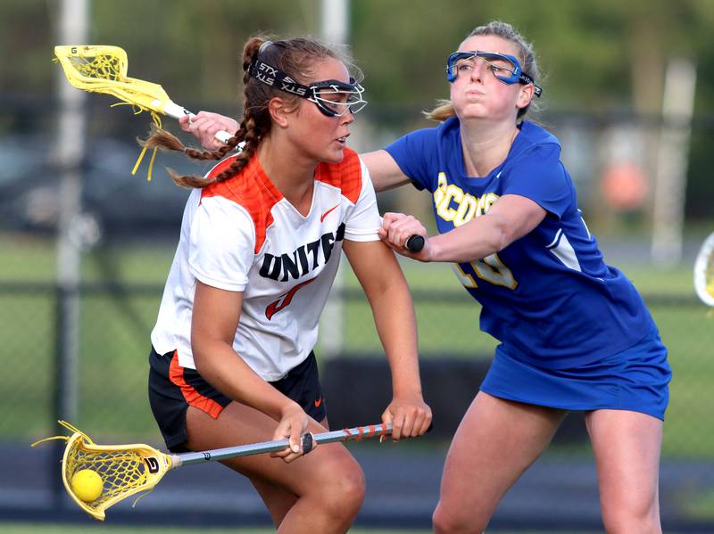 Crystal Lake Central’s  Fiona Lemke, left, battles Lake Forest’s Maeve Farrell during girls lacrosse supersectional action at Metcalf Field on the campus of Crystal Lake Central Tuesday.