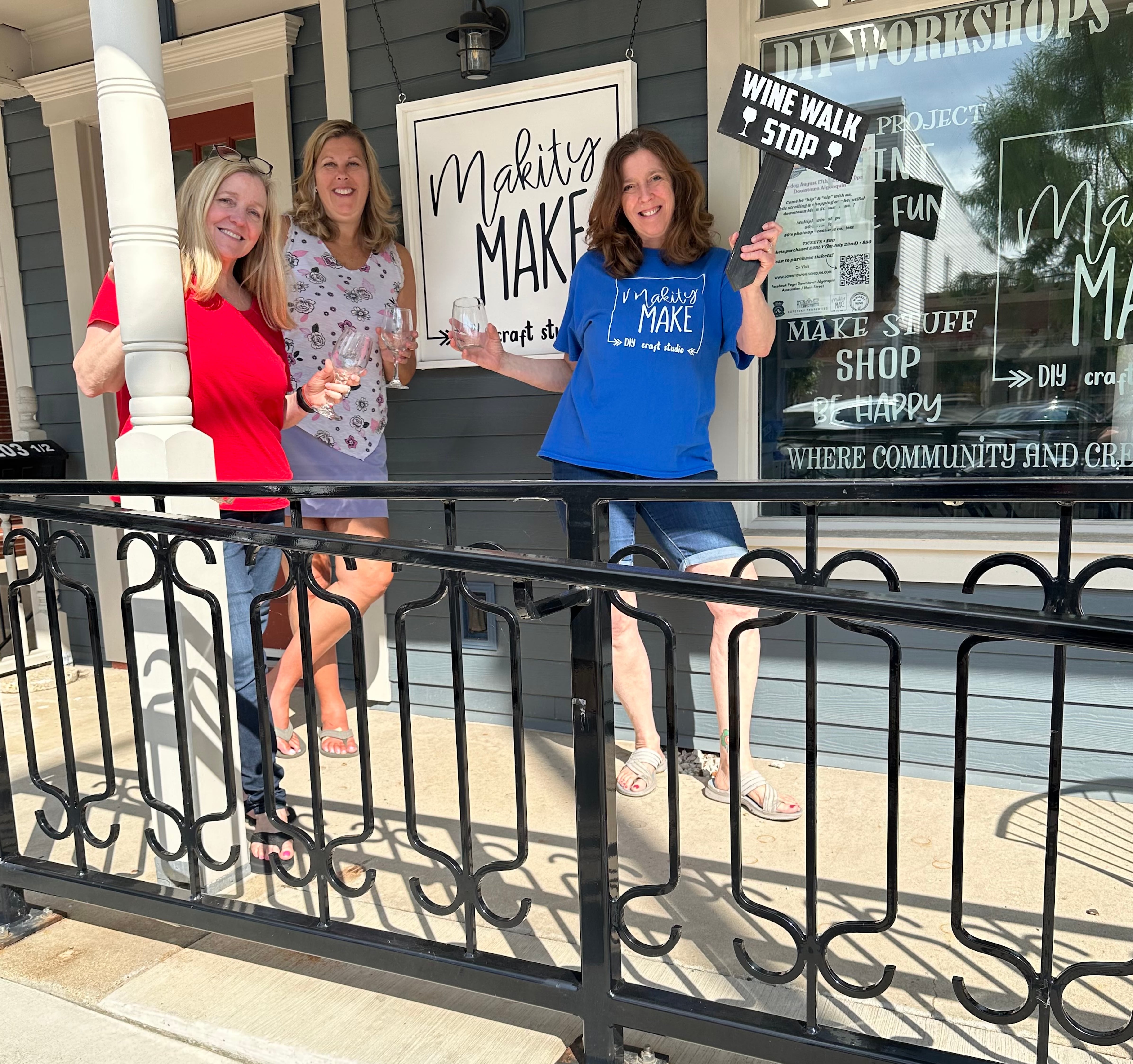 Wine attendants Janet Carter and Jenny Drecoll stand with Makity Make owner Julie Callahan, right. Makity Make is one of the 15 stops at the Summer Lovin' Wine Walk on Aug. 17, 2024.