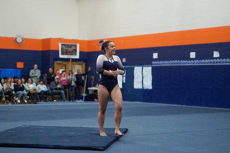 Oswego Co-op's Ava Sullivan smiles after competing in the floor exercise during a Oswego Regional Gymnastics Meet at Oswego High School on Monday, Jan 29, 2024.