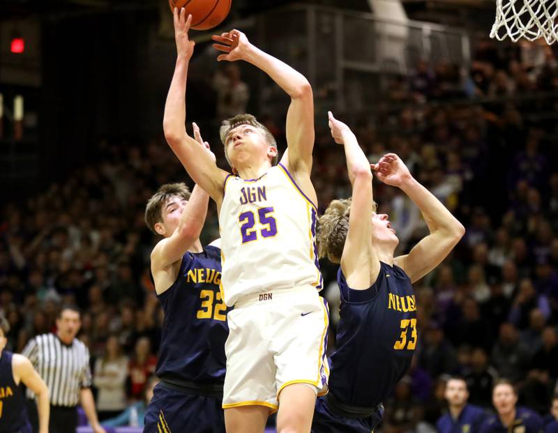 (Left to right) Neuqua Valley’s Luke Kinkade, Downers Grove North’s Alex Miller and Neuqua Valley’s Joe Balgro go after a rebound during the Class 4A Downers Grove North Regional final on Friday, Feb. 23, 2024.