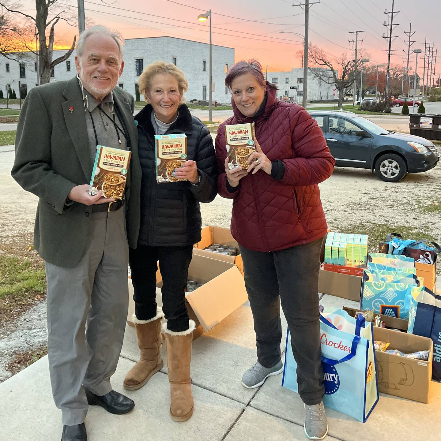 Steve Johnson, Jan Kuntz and Gloria Dennison pose with boxes of stuffing in a photo provided by Stage Coach Players.