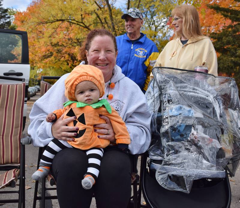 Michelle Pionto holds her 6-month-old grandson J.J. Carpenter, who is dressed as a pumpkin, during the Sycamore Pumpkin Festival Parade, held Sunday, Oct. 31, 2021.