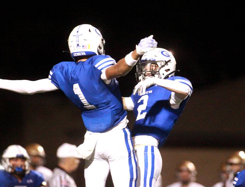 Geneva’s Talyn Taylor (left) and Dane Turner celebrate Turner’s interception during a game against Lemont Friday, Sept. 6, 2024 at Geneva.