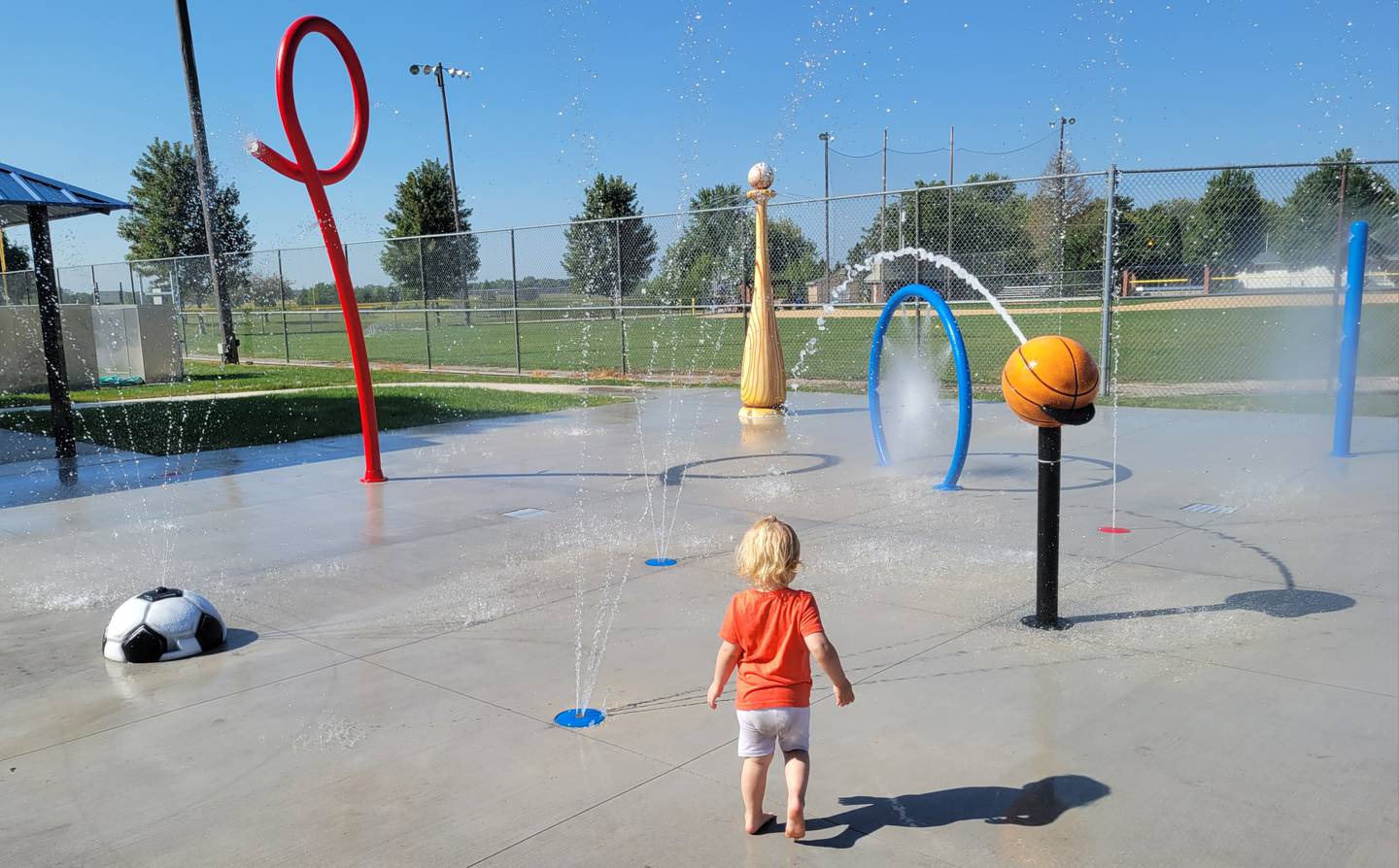 Three-year-old Michaela Walters of Ottawa weighs her options as she approaches the new splash at Peck Park on Ottawa’s south side on Thursday morning.