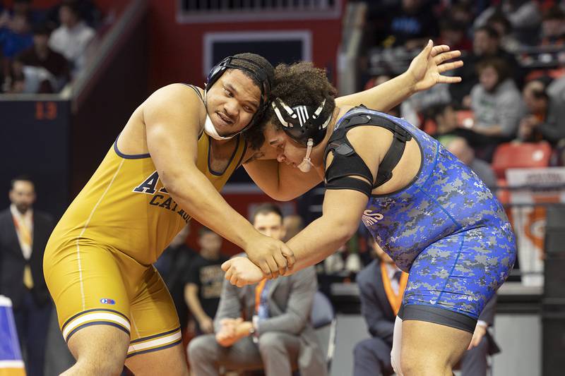 St. Francis’ Jaylen Torres (right) and Althoff’s Jason Dowell face off in the 1A 285 pound championship match Saturday, Feb. 17, 2024 at the IHSA state wrestling finals at the State Farm Center in Champaign.