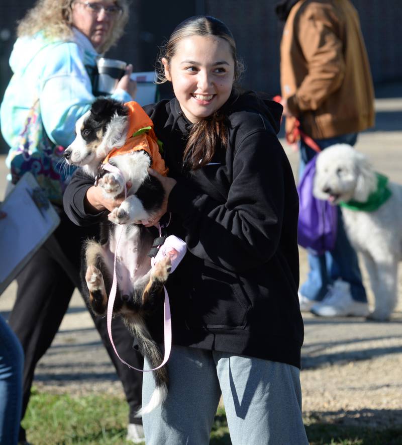 Iyianna Drowns of Polo holds her 11-week-old puppy Iris at Polo High School's 2024 Doggy Dash on Saturday, Sept. 7, 2024. Drowns is a junior at Polo High School.