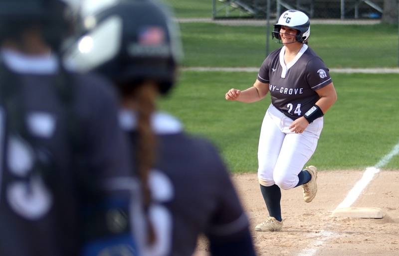 Cary-Grove’s Addison DeSomer trots the bases after a home run against Burlington Central in varsity softball at Cary Monday.