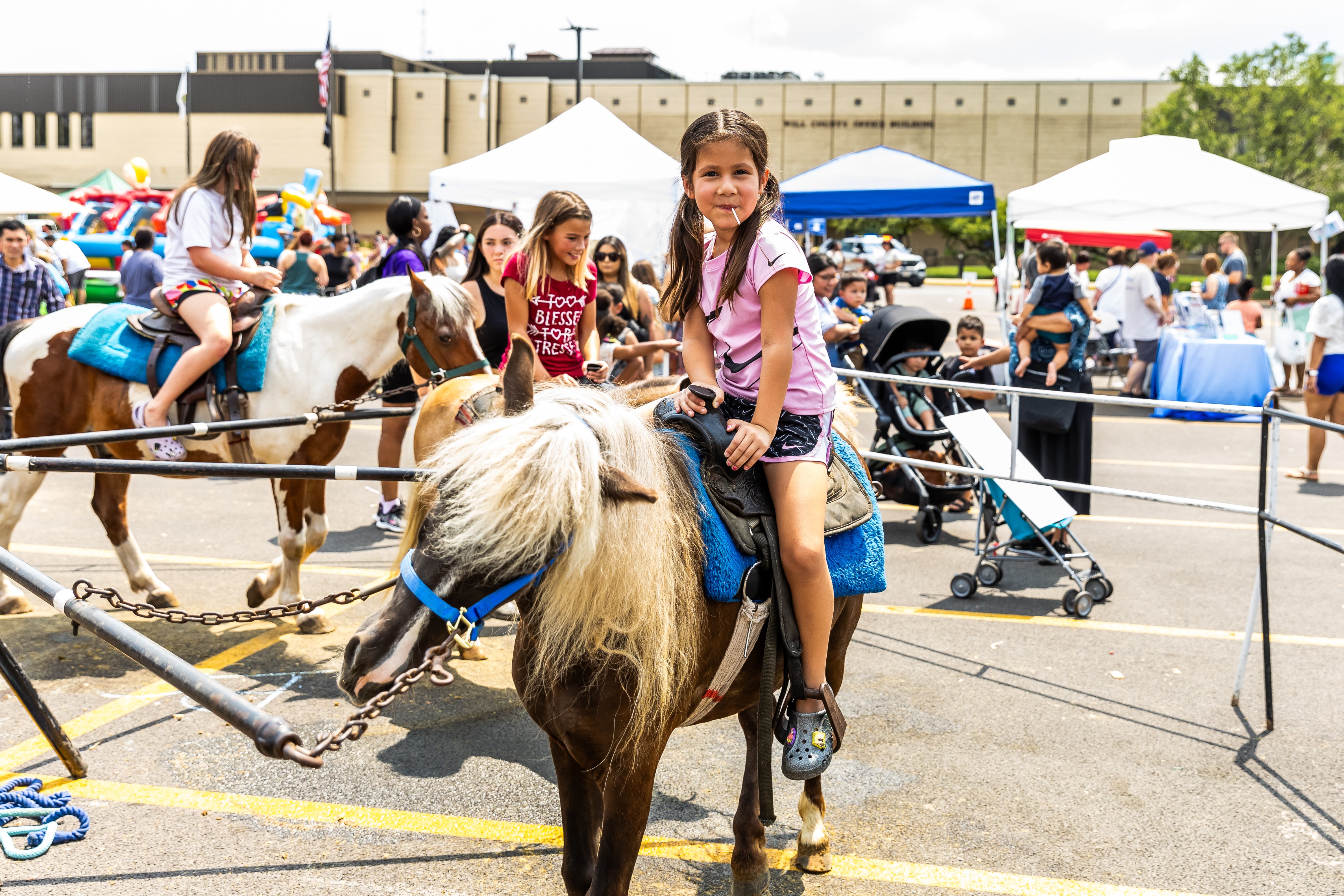 Plainfield resident Liliana Gardea (6) enjoys a pony ride at Kidz Fest in Joliet on Aug. 3, 2024.