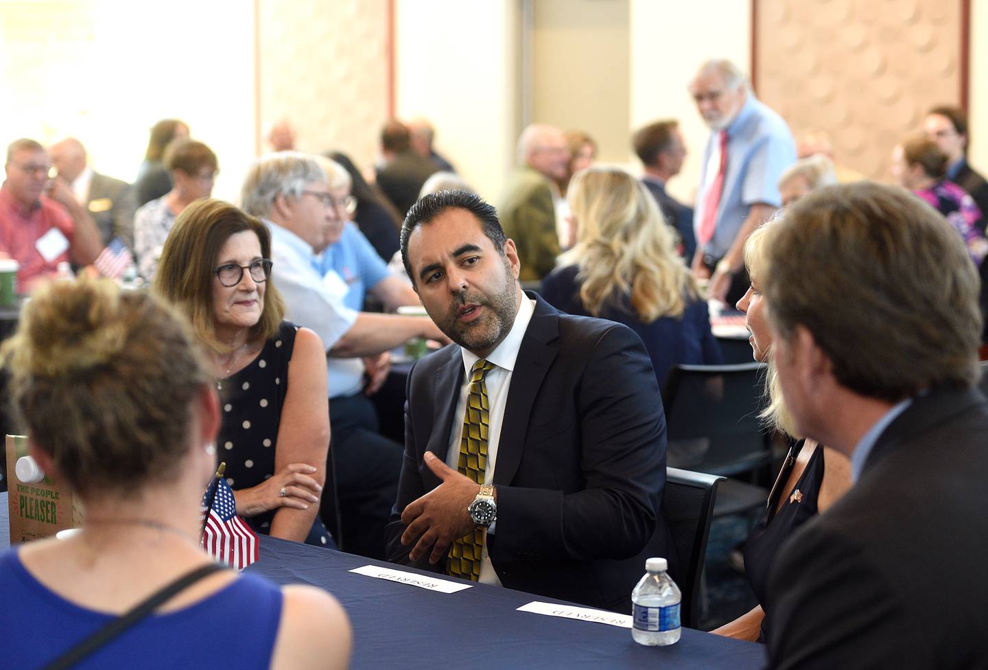 Norway's President of the Storting Masud Gharahkhani speaks with business and political leaders at the Geneva Public Library Friday. Gharahkhani is on a tour of the midwest before an upcoming NATO summit.