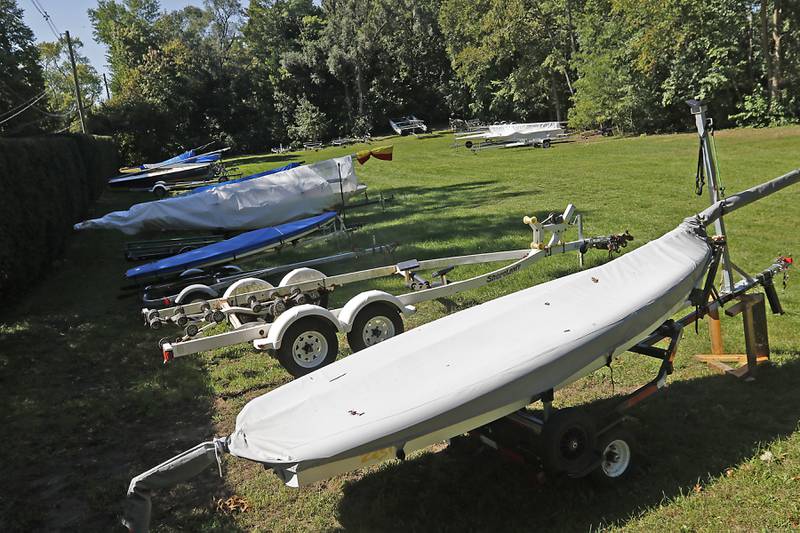 A sailboats and trailers parked at Pistakee Yacht Club on Tuesday, Oct. 3, 2023. The yacht club has been parking boats and trailers on a lot next to the club since 1970, with a variance from the county. The Village of Johnsburg says they are in violation and have to move them boats and trailers from the lot.