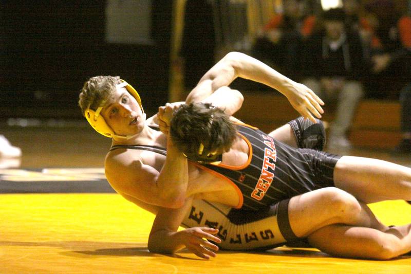 Jacobs’ Billy Albrecht battles Crystal Lake Central’s Rene Gaunaurd at 160 pounds in varsity wrestling Thursday at Algonquin.