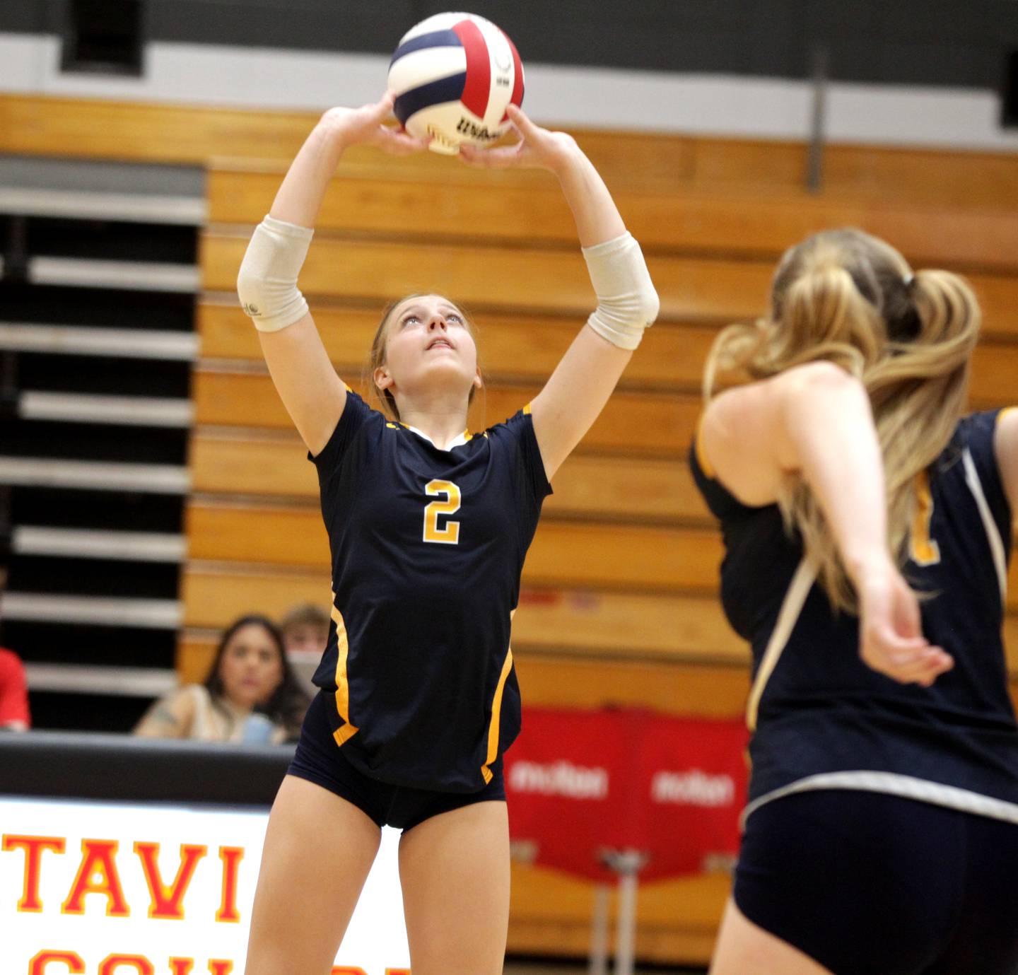 Neuqua Valley’s Aubrey Dumstorff sets the ball during a game at Batavia High School on Tuesday, Aug. 29, 2023.