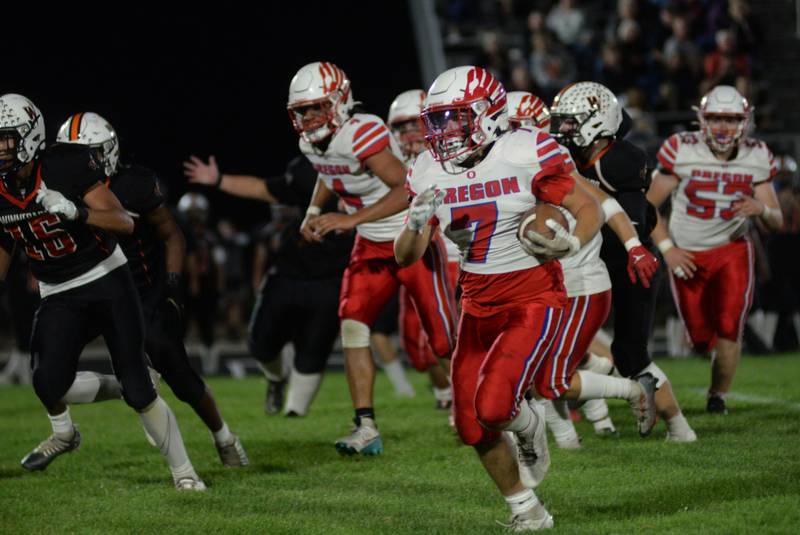 Oregon's Logan Weems runs for a gain during Friday, Sept. 15, 2023 action against the Winnebago Indians at Winnebago High School.