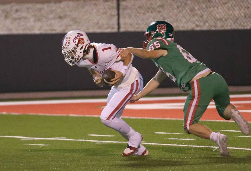 Ottawa quarterback Mark Munson avoids the sack from L-P's Beau Lawerence  on Friday, Sept. 13, 2024 at Howard Fellows Stadium.