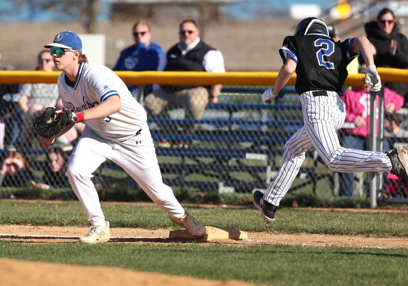 Hinckley-Big Rock’s Justin Wentzlaff gets the putout at first as Newark's Jacob Seyller tries to beat the throw Monday, April 8, 2024, during their game at Hinckley-Big Rock High School.