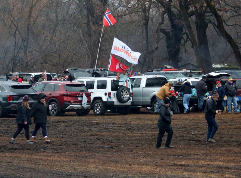 Walkers and motorists alike encountered significant mud in parking areas during the 119th Norge Annual Winter Ski Jump Tournament in Fox River Grove Sunday.