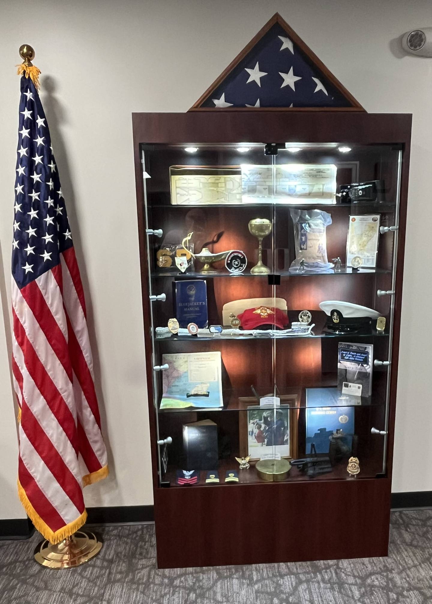 The Lockport Township veterans memorial cabinet contains items donated by local veterans.