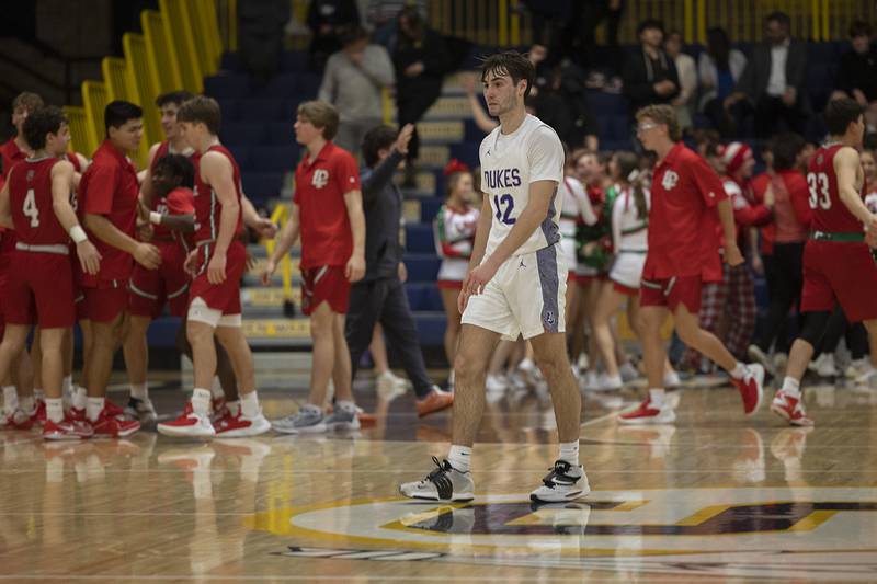 Dixon’s Bryce Feit walks off the court after the Dukes lost to LaSalle-Peru Wednesday, Feb. 21, 2024 at the Sterling class 3A basketball regional.