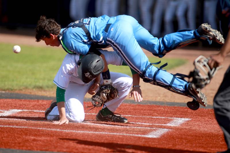 York’s Paul Reedy is safe at home plate under Lake Park catcher Jack Saylor during a Class 4A St. Charles North Sectional semifinal game on Wednesday, May 29, 2024.