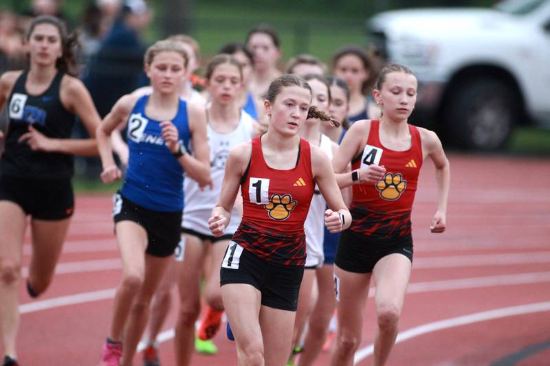 Batavia’s Avery Hacker leads the varsity 3200-meter run during the DuKane Conference Girls Outdoor Championships at Lake Park in Roselle on Thursday, May 2, 2024.