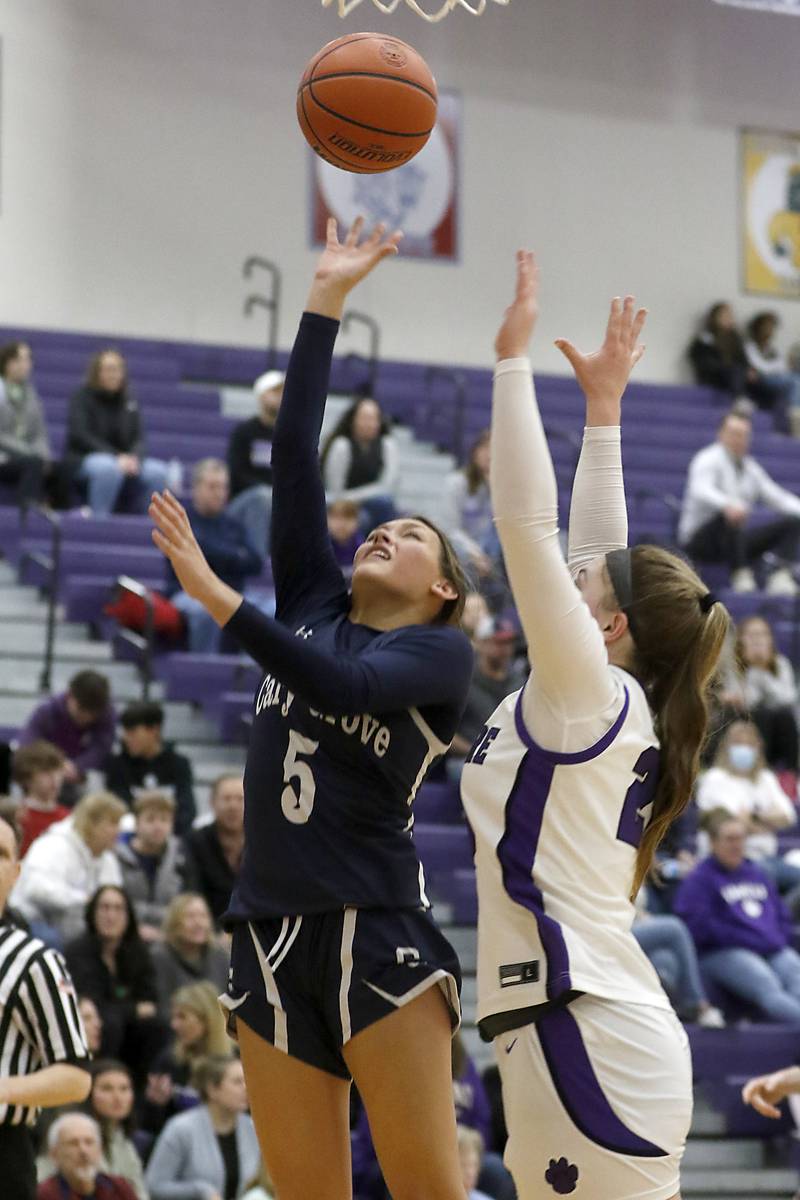 Cary-Grove's Morgan Haslow shoots the ball in front of Hampshire's Chloe Van Horn during a Fox Valley Conference girls basketball game Friday, Jan. 26, 2024, at Hampshire High School.