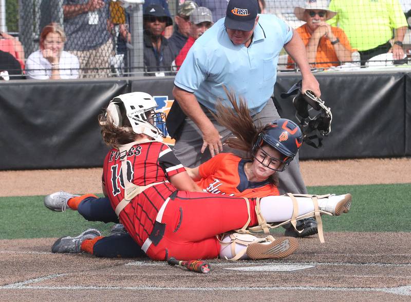 Yorkville catcher Kayla Kersting tags out Oak Park-River Forest's Anne Stine while sliding into home during the Class 4A State semifinal softball game on Friday, June 9, 2023 at the Louisville Slugger Sports Complex in Peoria.