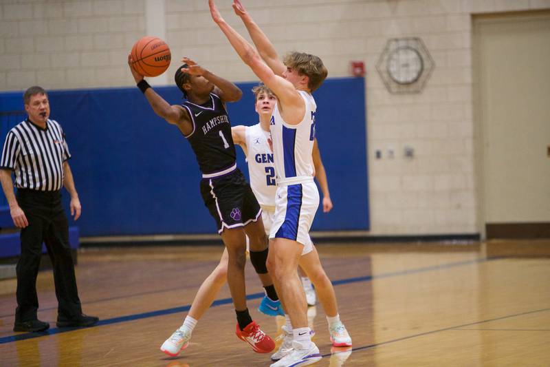 Hampshire's Chayse Gray is double teamed by Geneva's Hudson Kirby (25) and Jack Hatton (20) at Geneva Day of Hoops on Monday, Jan. 15th in Geneva.