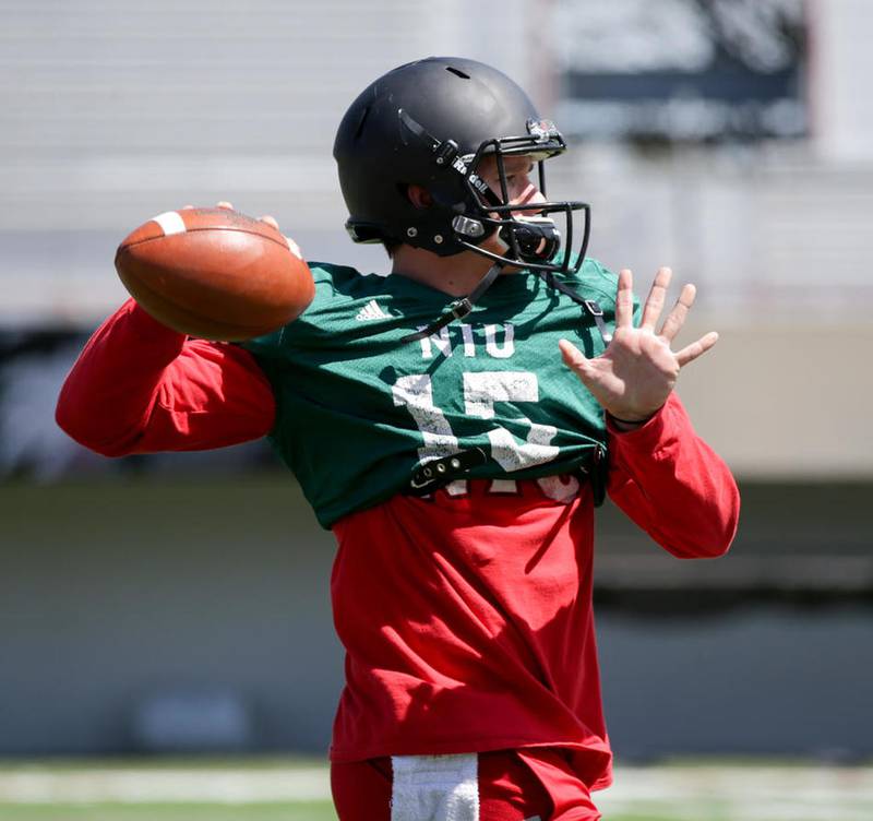 Northern Illinois University quarterback Marcus Childers (15) throws a pass during warm-ups before the NIU Spring Bowl at Huskie Stadium in DeKalb April 22.