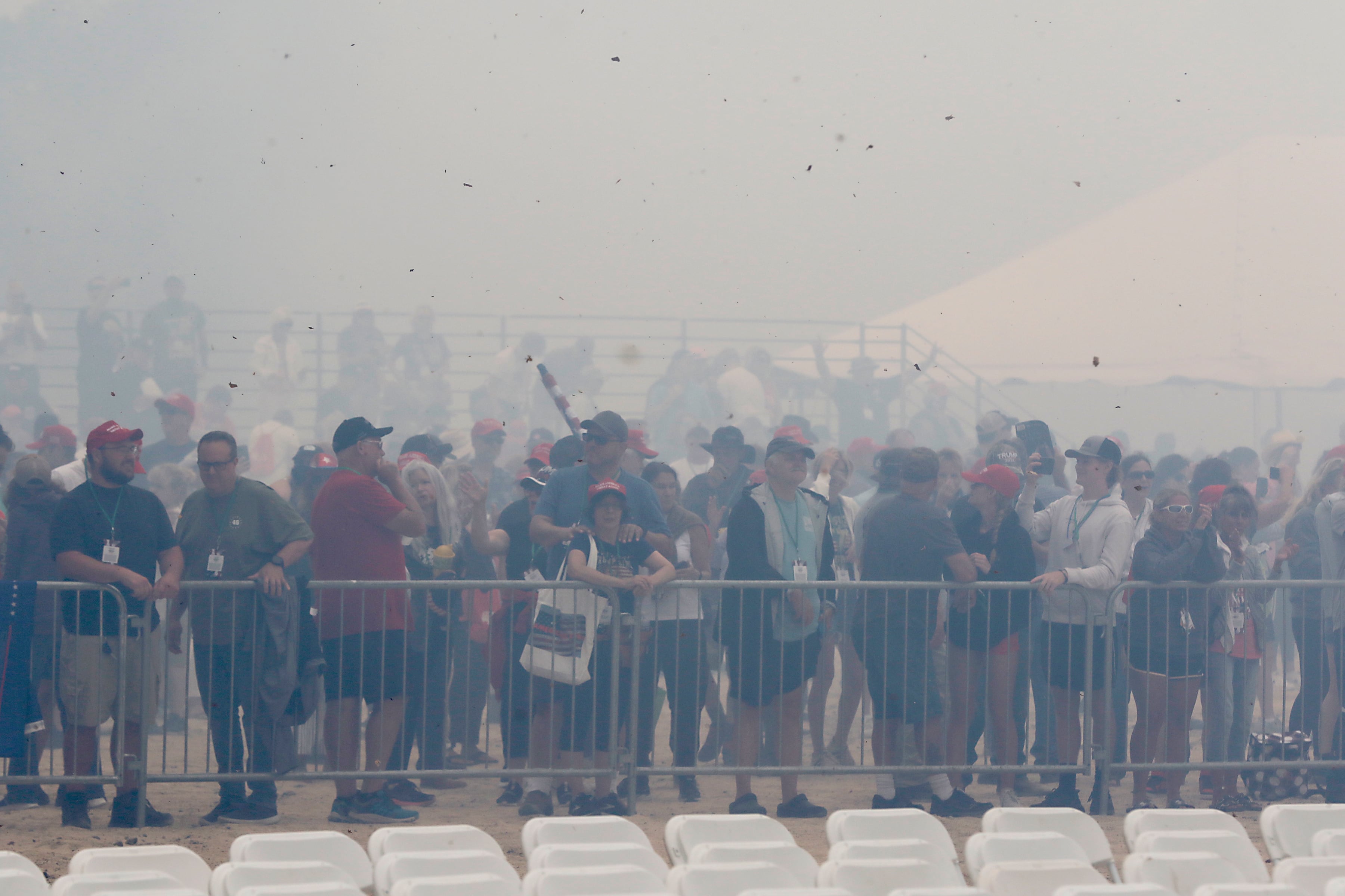 Smoke from the fireworks engulf the crowd during the Trump Now-Save the American Dream Rally at the McHenry County Fairgrounds on Sunday Aug. 18, 2024, in Woodstock.