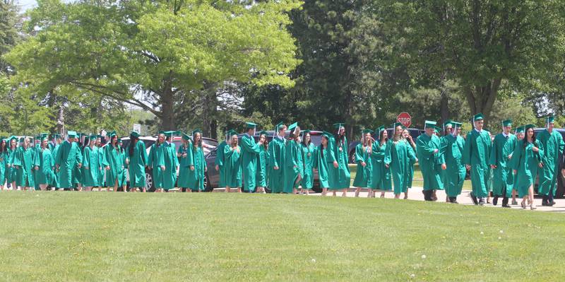 Graduates walk in procession to the Abbey Church for the commencement ceremony on Sunday, May 19, 2024 at St. Bede Academy.