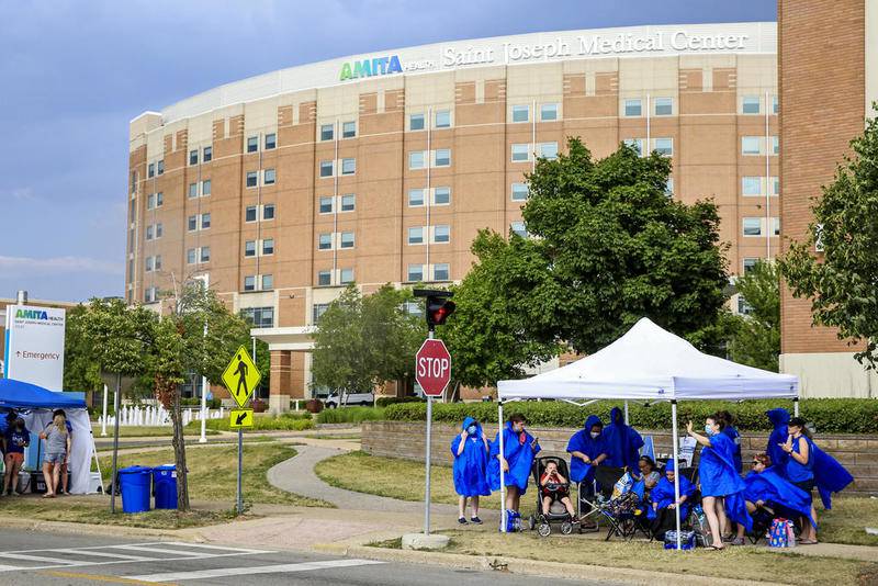 Nurses can be seen picketing Wednesday outside AMITA Health Saint Joseph Medical Center Joliet.