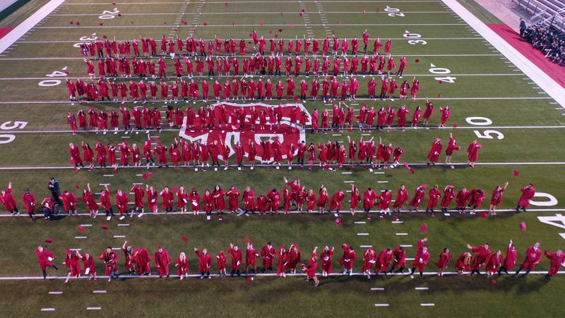 La Salle-Peru Township High School class of 2024 students throw their caps in the air during the 126th annual commencement graduation ceremony on Thursday, May 16, 2024 in Howard Fellows Stadium.