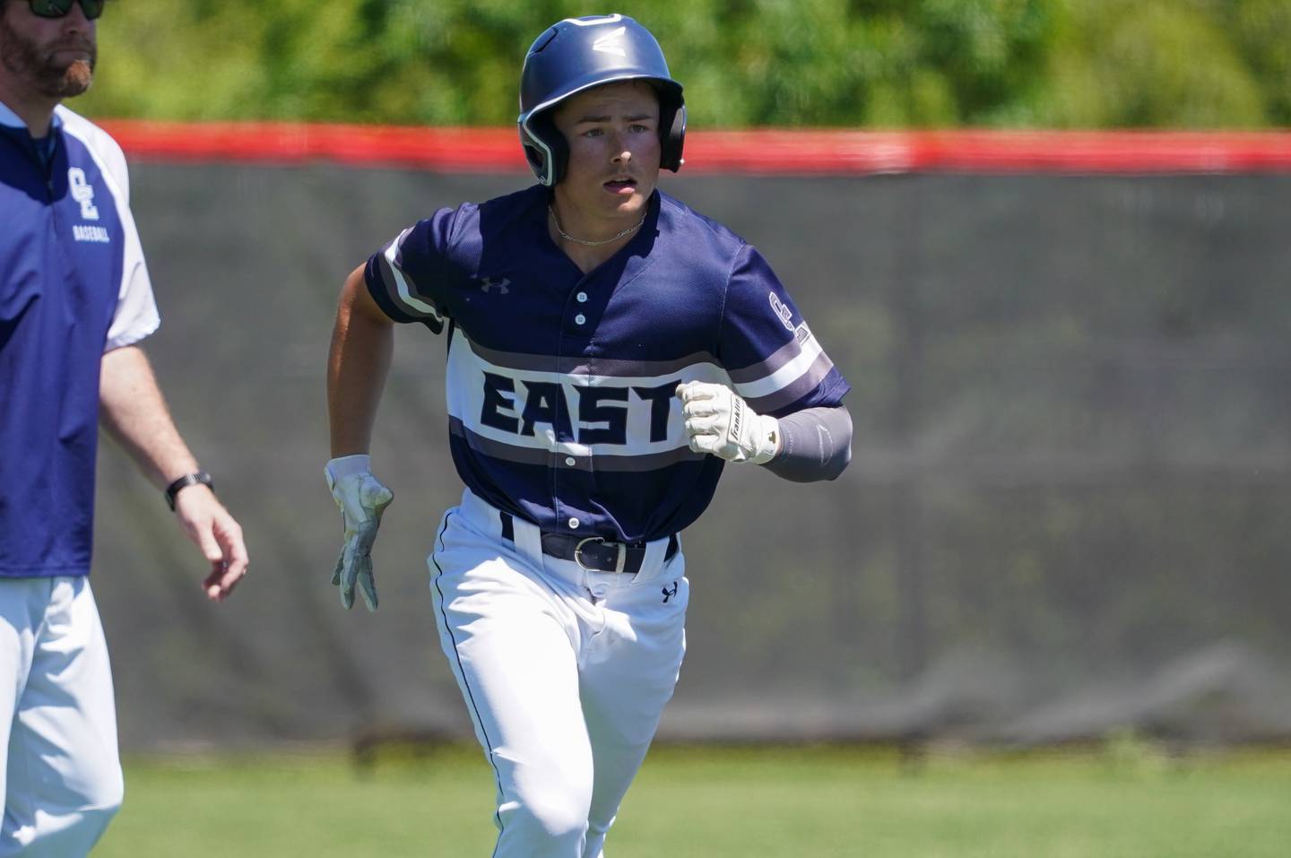 Oswego East's Will Bass (4) rounds third base after hitting a homer against Downers Grove North during a 4A Bolingbrook Regional Championship baseball game at Bolingbrook High School on Saturday, May 25, 2024.