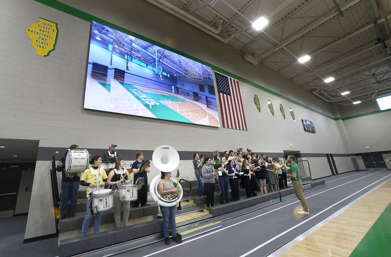 The Seneca High School band plays during the open house for the new gymnasium. The gym boasts the largest high school video board in Illinois.