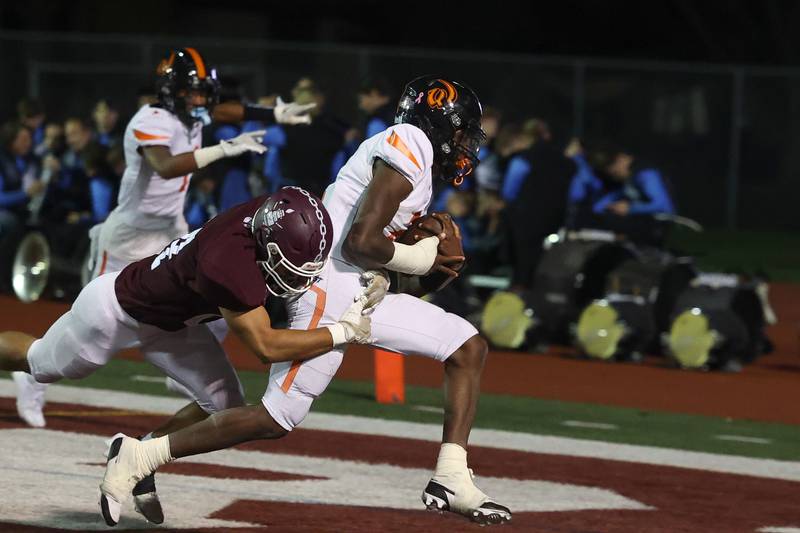 Lincoln-Way West’s Jahan Abubakar scores the 2-point conversion against Lockport on Friday, Oct. 18, 2024 in Lockport.