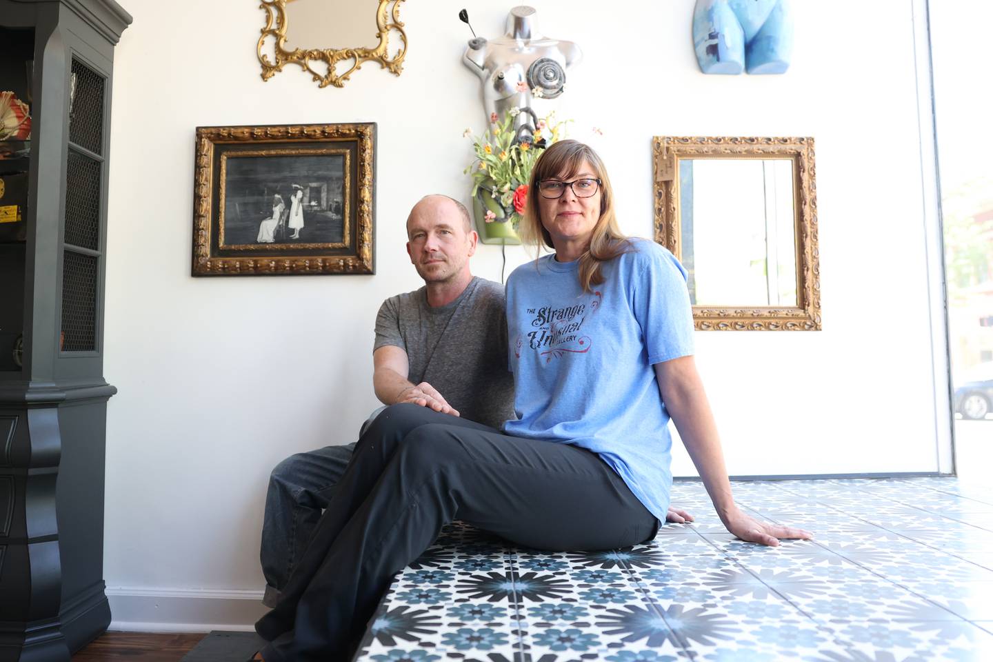 Terry and Christine Nordstrom pose for a photo in their Strange and Unusual Gallery in downtown Joliet on Friday, May 26, 2023.