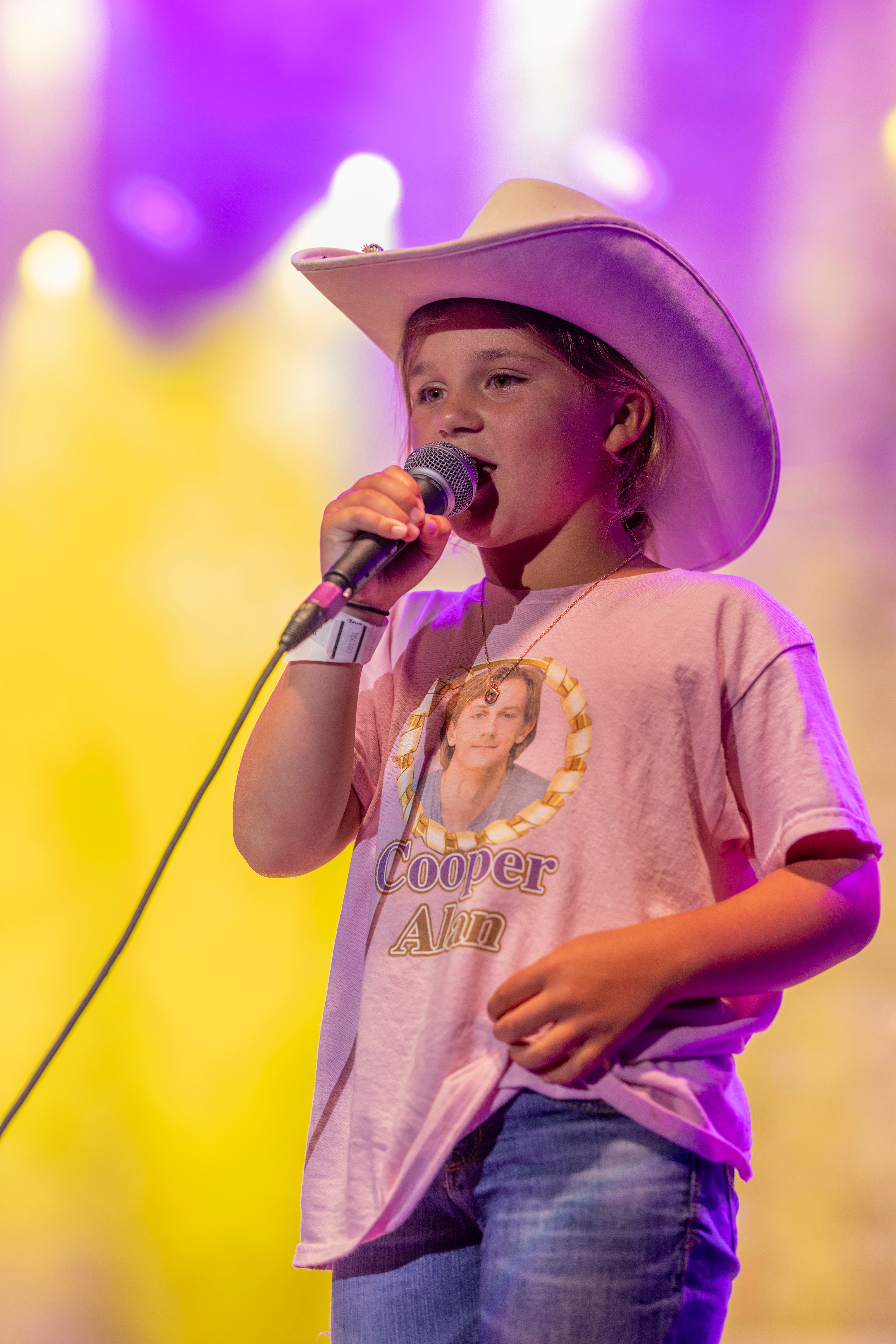 Cooper Alan fan Landyn Boltz was asked to come up on stage to sing along for a song during Alan's set at Streatorfest on August 2, 2024.