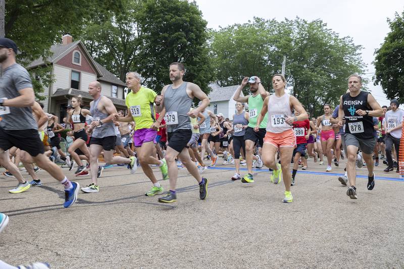 Runners fire out of the gate Saturday, July 1, 2023 at the start of the 23rd annual Reagan Run in Dixon. The 5K starts at the Reagan Boyhood home and ends at Haymarket Square.