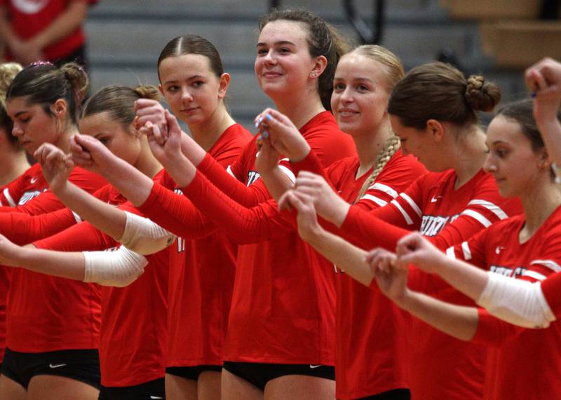 Huntley’s Georgia Watson, center, and the Red Raiders prepare to face Crystal Lake Central in a Fox Valley Conference volleyball match on Tuesday, Aug. 27, 2024, at Huntley High School.