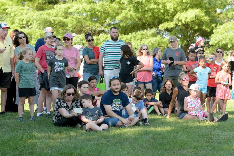 Attendees watch the Police K-9 demonstration by the Campton Hills Police Department during the National Night Out event on Tuesday, August 2, 2022.