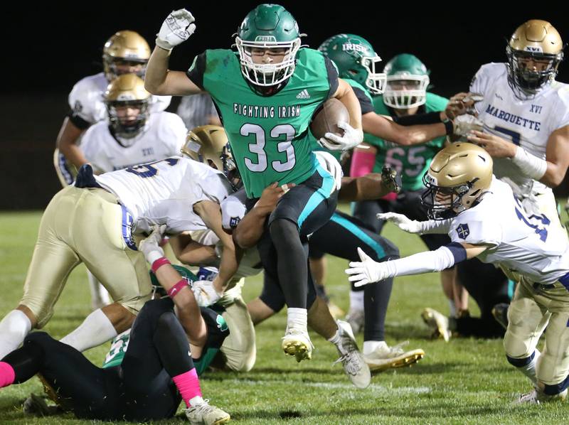 Seneca's Cameron Shriey breaks free of Marquette defenders to score a touchdown on this run on Friday, Oct. 18, 2024 at Seneca High School.