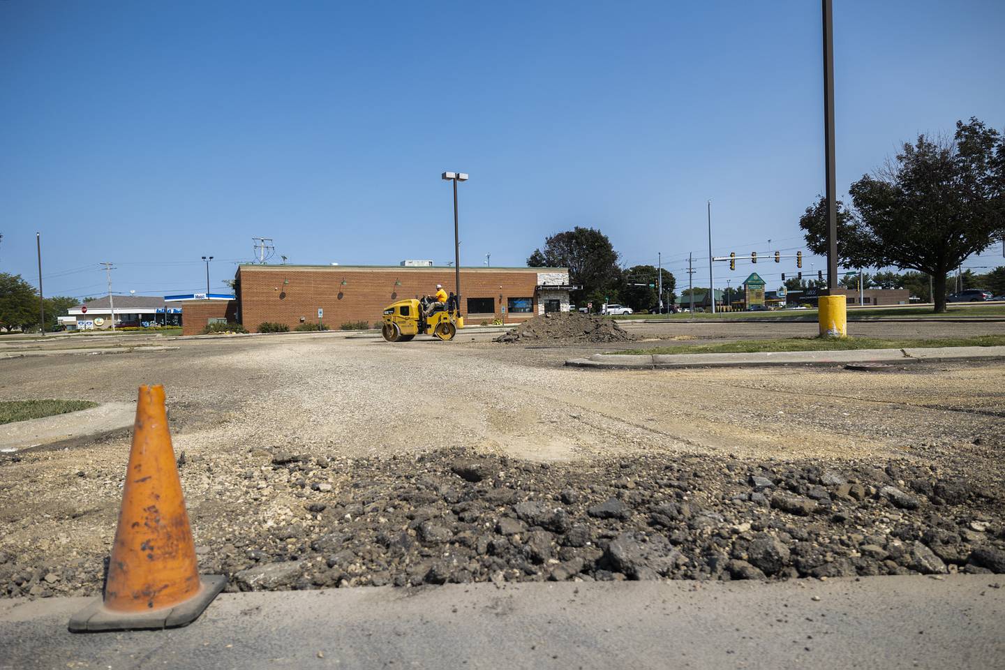 Eric Edler of Porter Brothers works on the parking lot of the former Applebees restaurant Tuesday, Sept. 10, 2024, in Sterling. Paving will begin next week. The restaurant closed in 2020 after 20 years in business.