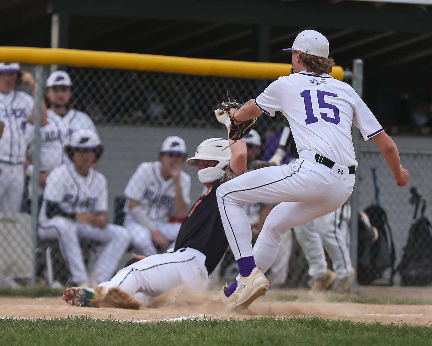 Sandwich's Tyler Lissman (7) slides safely into home during baseball game between Sandwich at Plano.  May 8, 2024