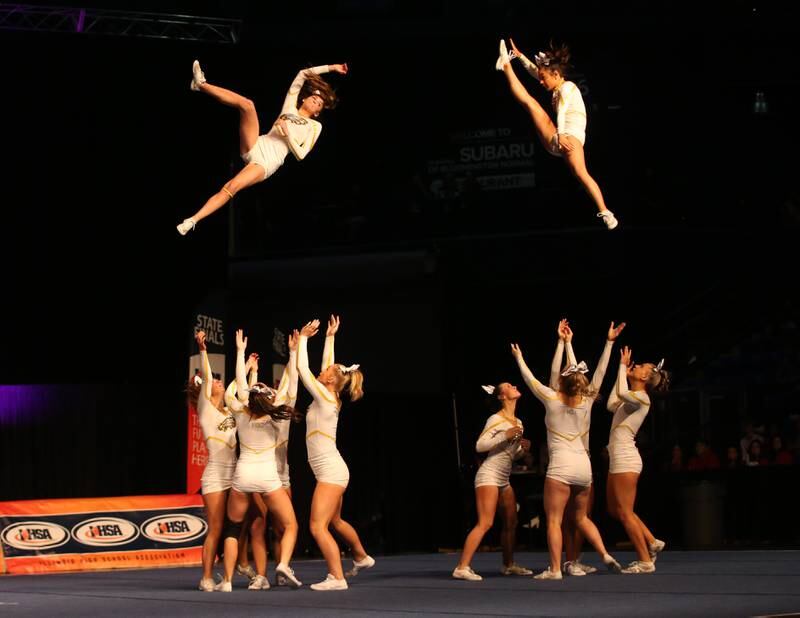 Members of the Jacobs High School cheer team perform during the IHSA Cheer State Finals in Grossinger Motors Arena on Saturday, Feb. 4, 2023 in Bloomington.