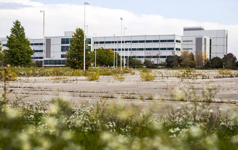 The vacant Motorola campus, now owned by Optima International, appears to have reduced maintenance on the grounds. The power has been shut off, and the property taxes, more than $329,000 for this year, have not been paid.