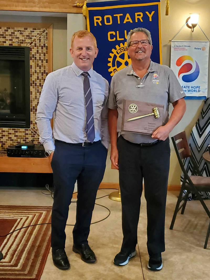 Princeton Rotary Club’s 2023-2024 President Joe Park was presented with a plaque in appreciation for his year of leadership. He is pictured holding the plaque after receiving it from incoming president for 2024-2025, Eric May.