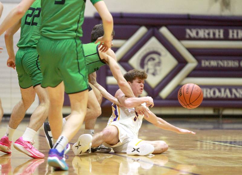 Downers Grove North’s Owen Thulin (far right) gets tangled up with York’s defense during a game at Downers Grove North on Friday, Jan. 19, 2024.